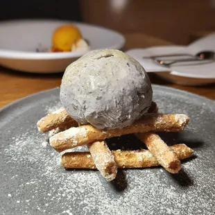 Jenga tower, chewy textured corn sticks, black sesame gelato, Korean seven grain powder