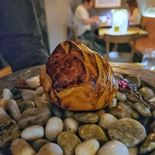 Beef wellington, beef tenderloin, zucchini, pine nut, Korean chive pesto, potato bread, 24 hours soy bordelaise sauce