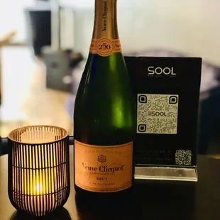 a bottle of wine and a candle