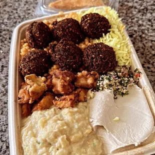 Falafel plate with Baba Ganoush Hummus and Fried Eggplant over Couscous &amp; Rice