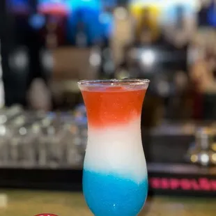 a blue, white and red drink