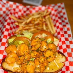 a shrimp sandwich and french fries