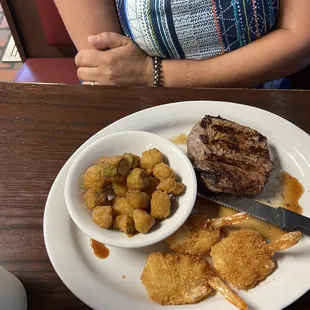 Surf and Turf. 6oz Sirloin and 3 butterfly shrimp with fried okra + salad bar. $14.99