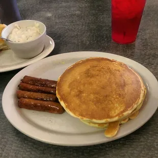 Pancake stack with sausage.