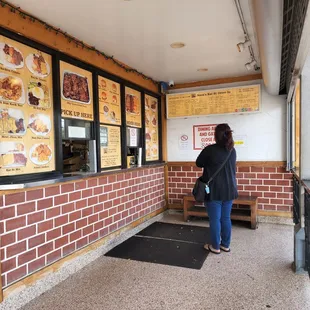 a woman standing in front of the door