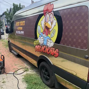 a chicken on the side of a van