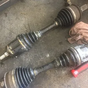 Two worn out front axles and broken CV Joint boots