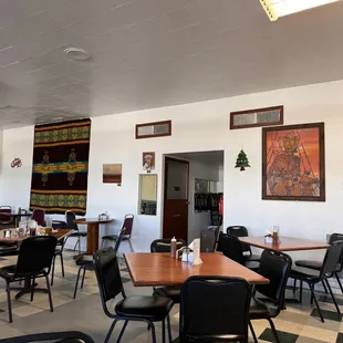 a dining room with tables and chairs