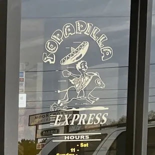 Front entrance window. Closed Sunday open mon-sat 11a- sometime at night... the numbers are missing but we were dining in there at 8pm