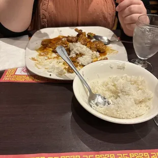 My wife eating rice and honey pepper chicken