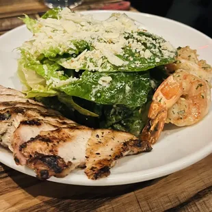 Caesar salad with grilled chicken and prawns