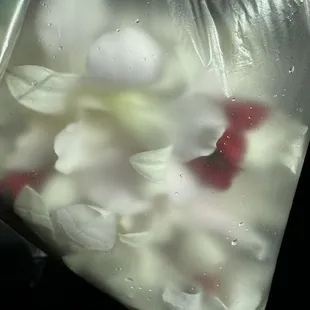 Orchid with red baby roses and red&amp;green ribbons.