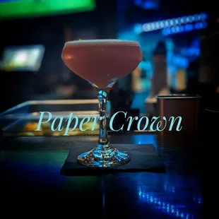 a pink cocktail in a glass