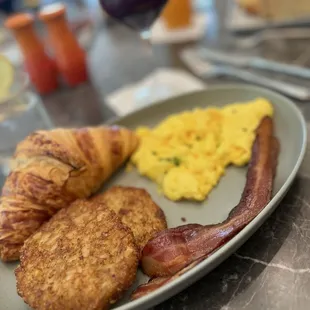 2 eggs, hash browns, butter croissant