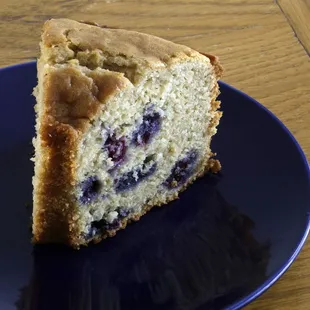 a slice of cake on a blue plate