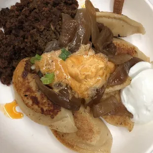 Pierogis, chorizo, onions and garlic butter