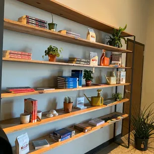 a man standing in front of a bookshelf