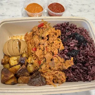 Custom bowl - purple rice, spicy pork, roasted potatoes, soy marinated egg.