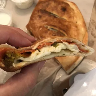 Calzone with provolone cheese, pepperoni &amp; jalapeños; it was delicious! Dip it in ranch!