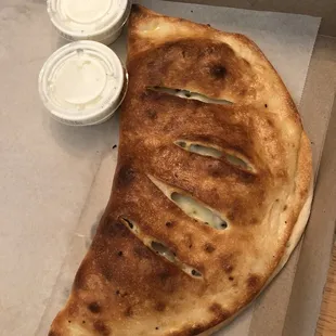 Calzone with provolone cheese, pepperoni &amp; jalapeños; it was delicious! Dip it in ranch!