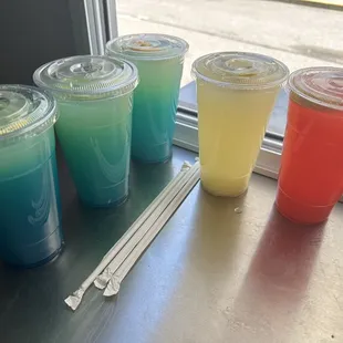 Fresh squeezed lemonade with flavors strawberry , electric blue, grape, or regular