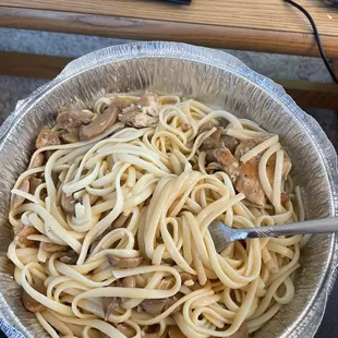 a bowl of pasta and meat