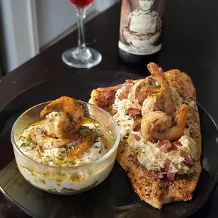a plate of food and a glass of wine