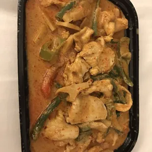Red curry with chicken. Absolutely delicious. A lot of flavor! I would suggest requesting no heat if you truly want a mild spice level.