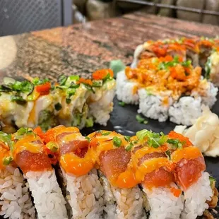 a sushi roll on a black plate