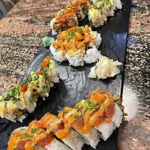 sushi on a black plate