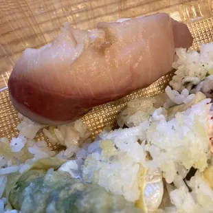 Hamachi served with the bloodline and browning/oxidizing flesh. Yuck.