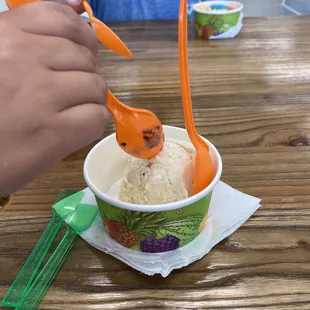 a person eating a bowl of ice cream