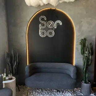a couch and two chairs in a living room