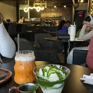 a woman sitting at a table in a restaurant