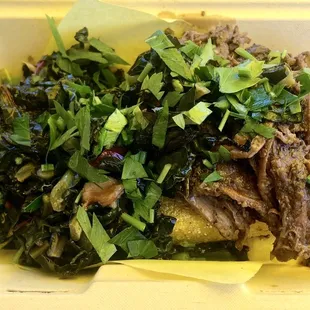 Braised beef over delicious polenta topped with a wonderful kale salad.