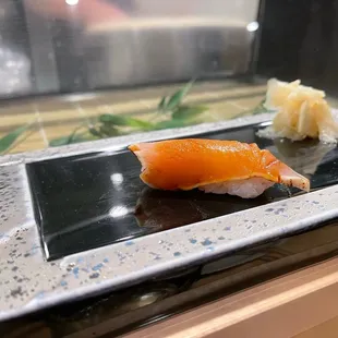 a plate of sushi on a counter