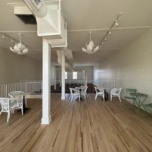 a wooden floor and white painted walls