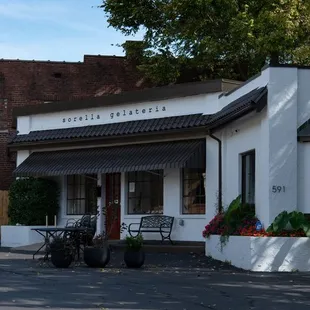  white building with a black roof