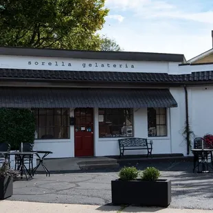  white building with a black awning