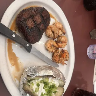 Filet, shrimp and baked potato.