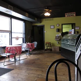 an empty restaurant with tables and chairs