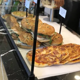 Sandwich and pizza of the day display.