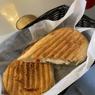 Chicken, provolone, red pepper, and pesto pressed sandwich