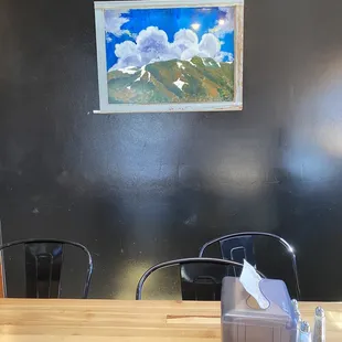 Cute artwork in their quaint dining area, we sat outside as well.
