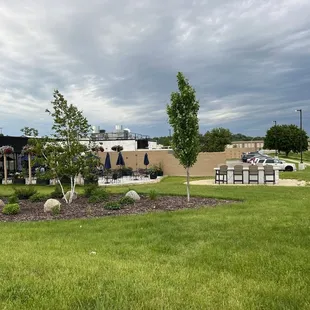 Patio seating by the Zumbro river
