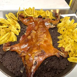 a roasting pig and french fries