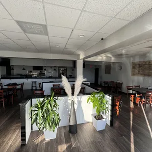 a dining area with tables and chairs