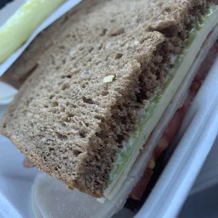 a sandwich in a styrofoam container