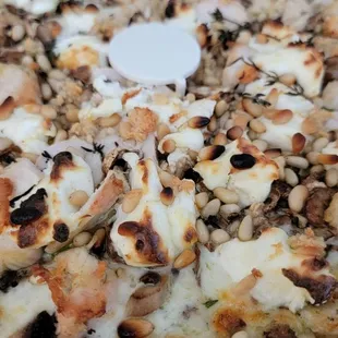 The new Mia Bella pesto type pizza. It was great! Pine Nuts make it pop.
