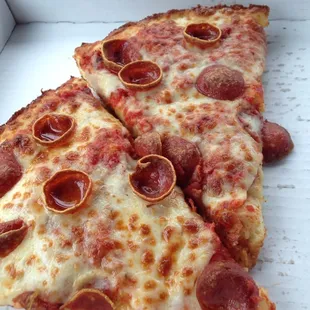 Lunch special: 2 Pepperoni Slices and a pop: $3.50